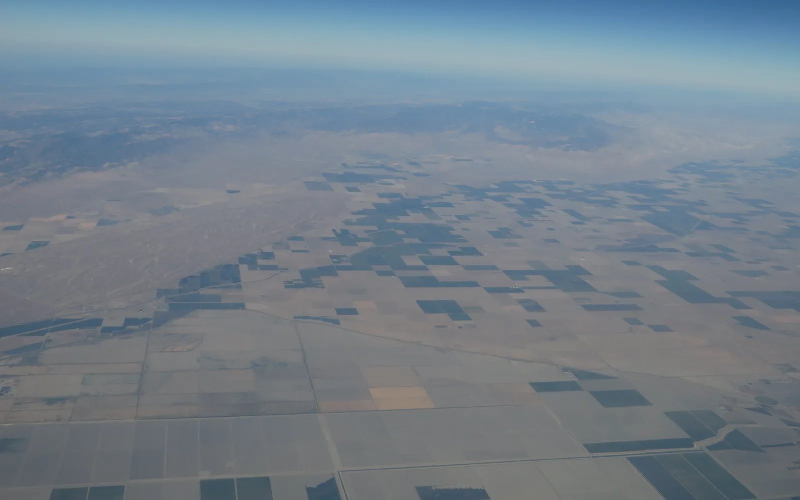 Aerial view of the Central Valley showing agricultural fields and the wide expanse of the valley landscape